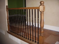 railing with metal balusters and turned newel posts